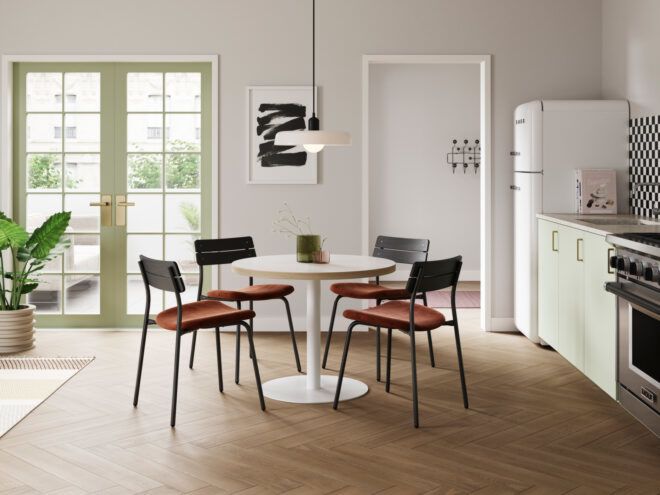 black chairs around white round dining table