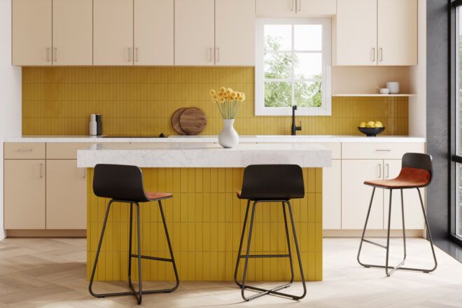 black bar stools against a yellow and white kitchen counter