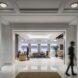 reception area with wood desk and sofas