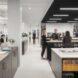 rows of long rectangular desks in an office