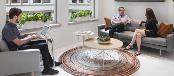 employees sitting on couches talking