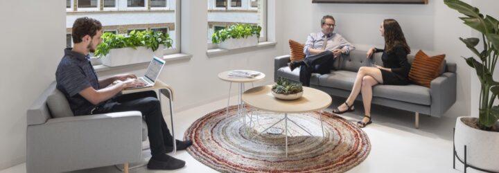 employees sitting on couches talking