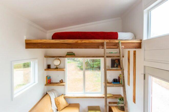 wood ladder leading to lofted bed
