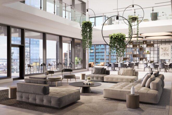 rendering of community living room with large gray sofas and hanging plants