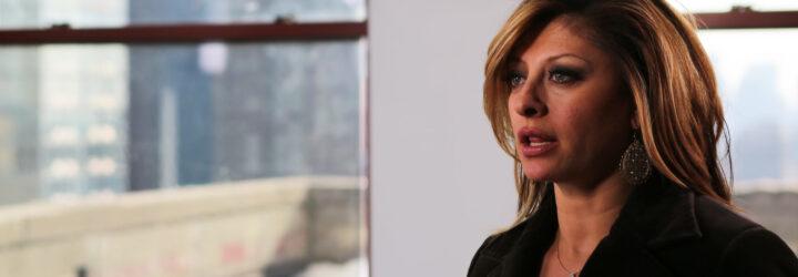An image of Maria Bartiromo looking off into the distance.