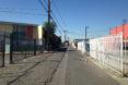 before image of empty alley surrounded by old factory buildings