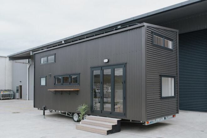 black two-story tiny home