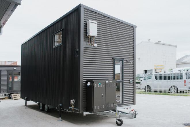 back of black tiny home