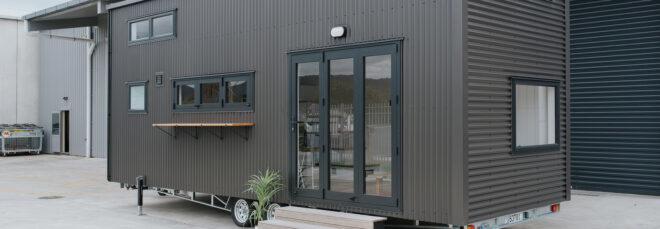 black two-story tiny home