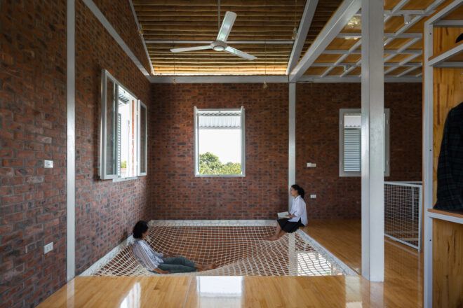 people lounging in netted floor