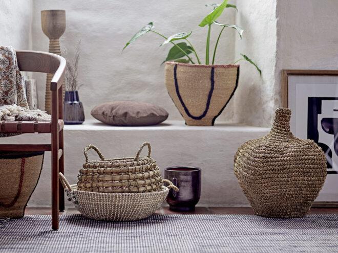 woven baskets with plants inside