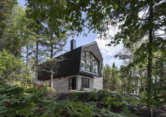 black and gray home with cantilevered upper floor