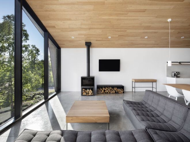 large gray sectional near fireplace