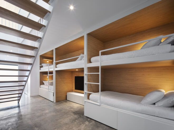 white bunk beds built into a wall