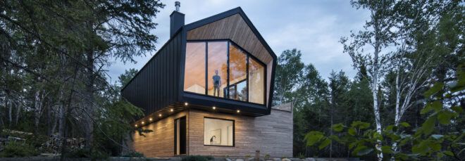 black and gray home with cantilevered upper floor