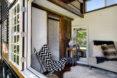 tiny home window open to reveal seating area inside