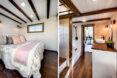 On the left, white bed in small room with wood-beamed ceilings. On the right, small hallway with wood floors and white walls