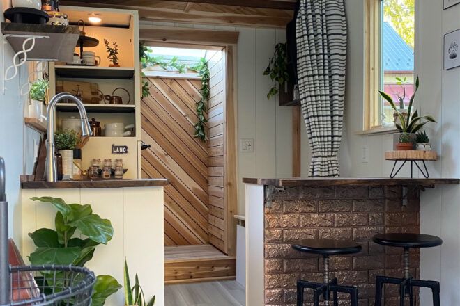 cedar-lined shower stall behind a tiny home kitchen