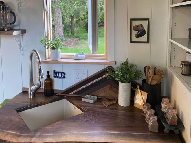 wood spoons and spices on wood counter