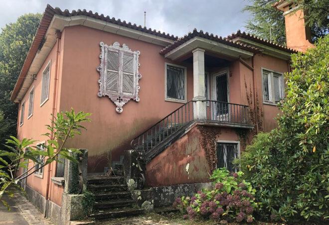 A home with a terracotta-colored facade.