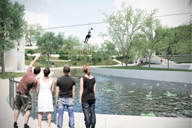 A zipline over a pond in a park.