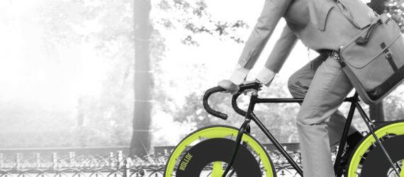 person on bike with green wheels