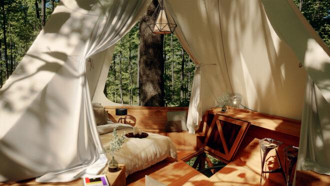 treehouse interior with large bed and wood table