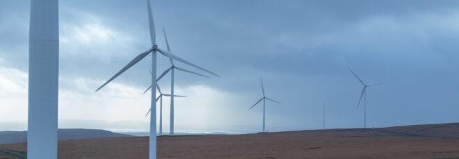 wind turbines on rolling hills