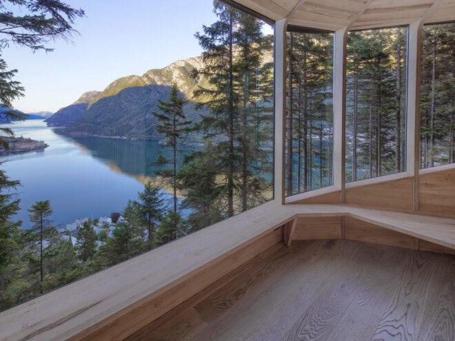 wall of glass revealing fjord views