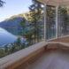 wall of glass revealing fjord views