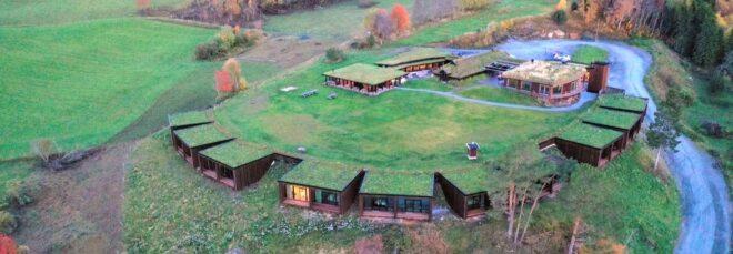 aerial view of hotel rooms with green roofs spaced in a radial formation