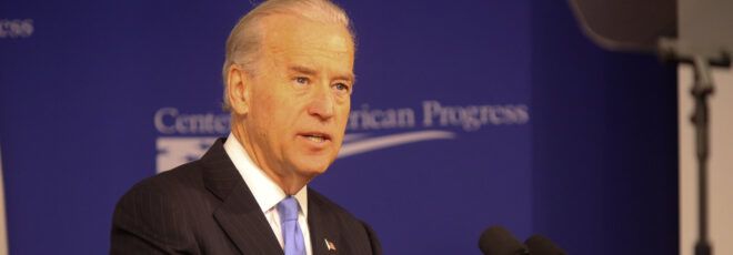 Joe Biden's face against a blue background.