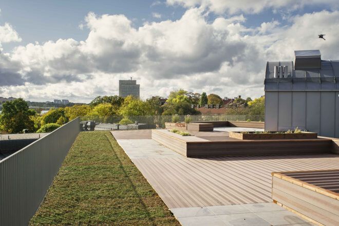 A green roof with a sitting area for socializing.