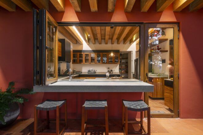 counter stools near kitchen with wood cabinets