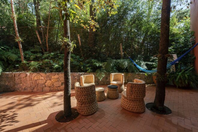 four wicker chairs on a patio