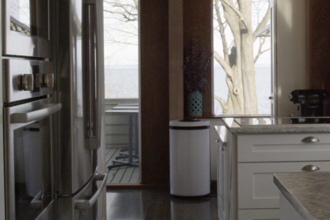 black and white round air purifier in a kitchen