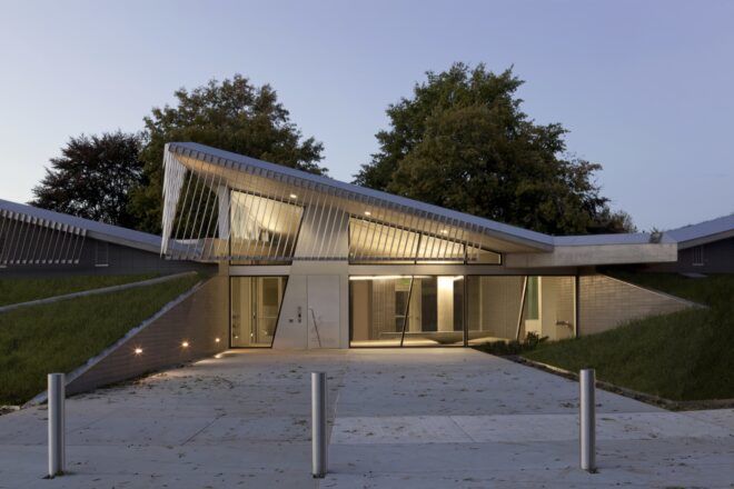 pathway leading to building with sharply angled roof