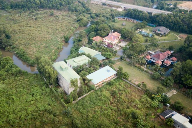A bird's-eye view of the building surrounded by greenery.