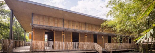 A two-story building with natural materials of bamboo and rice husk.