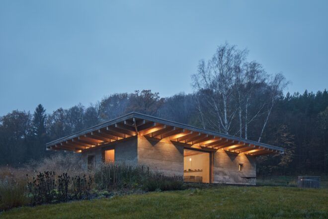 hempcrete home lit up at night