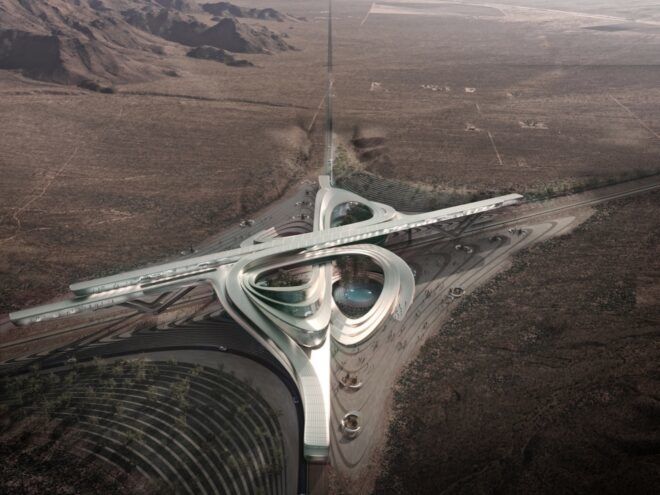A bird's-eye view of a silver structure in a loop formation.