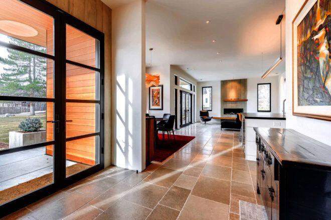 A hallway leading from the entry room into the living room.