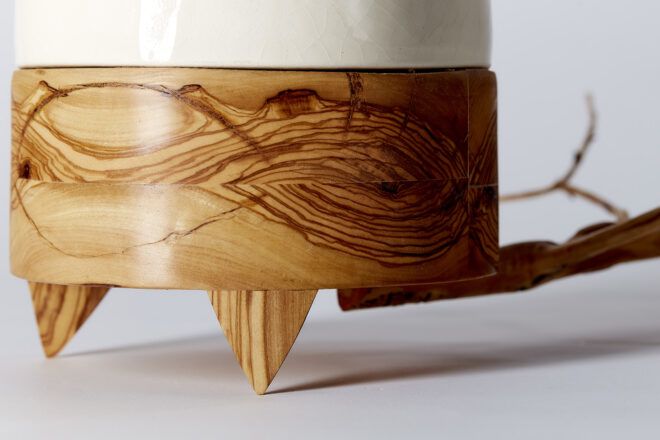 A close-up of the planter's wood base.