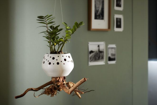 A hanging planter following the same design as the first, save for a smaller, squat shape.
