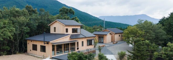 cedar-clad buildings with pitched roofs