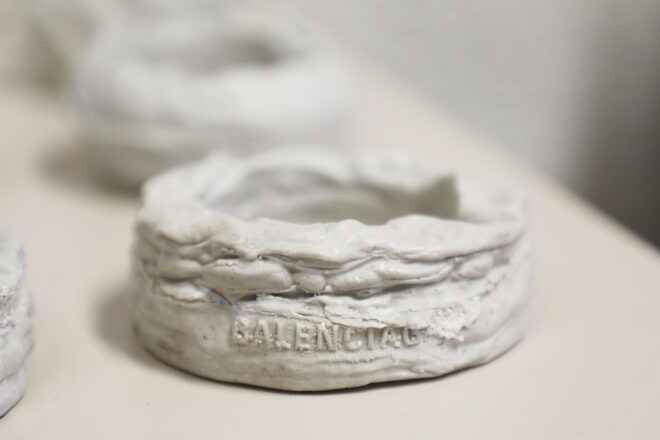 rows of white Balenciaga bracelets