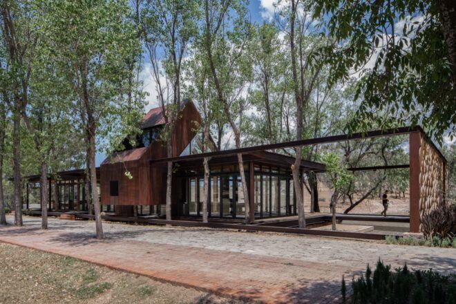 glass and steel home with large windows