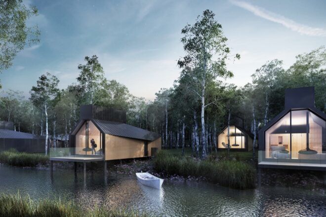 rendering of gabled cabins by a river