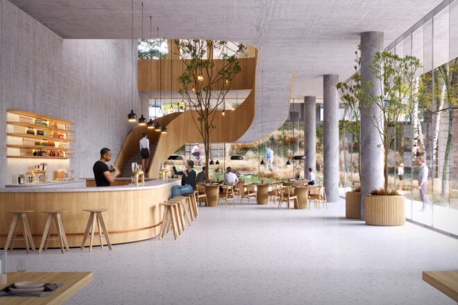 A lobby with light gray walls, floors and ceiling. Wood accents make up the main desk and stariway.
