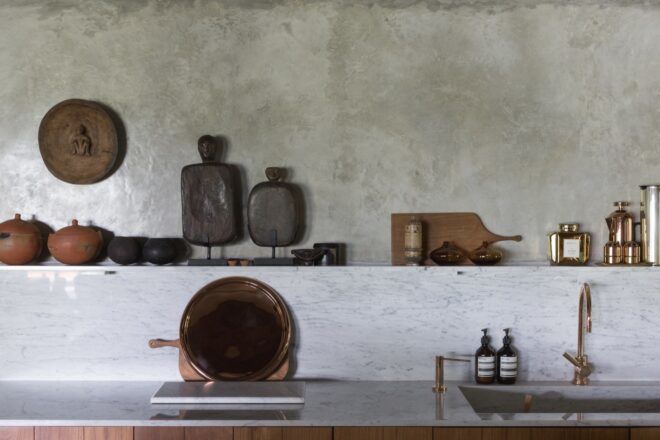 wood cutting boards and clay décor on kitchen counter